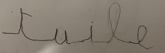Le mot « tuile » écrit avec des lettres très espacées les unes des autres.